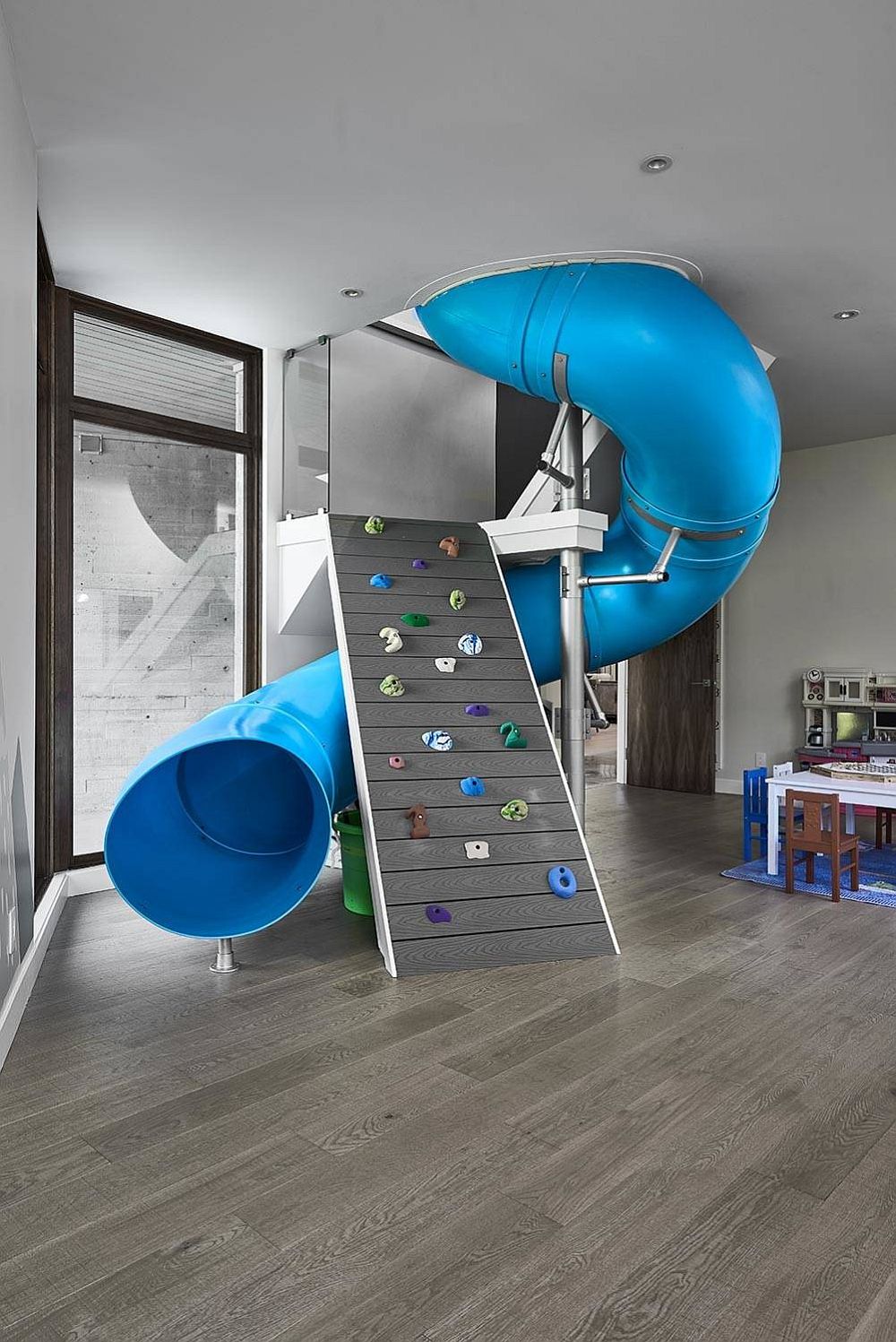 Tube slide and climbing wall rolled into one in the kids' room