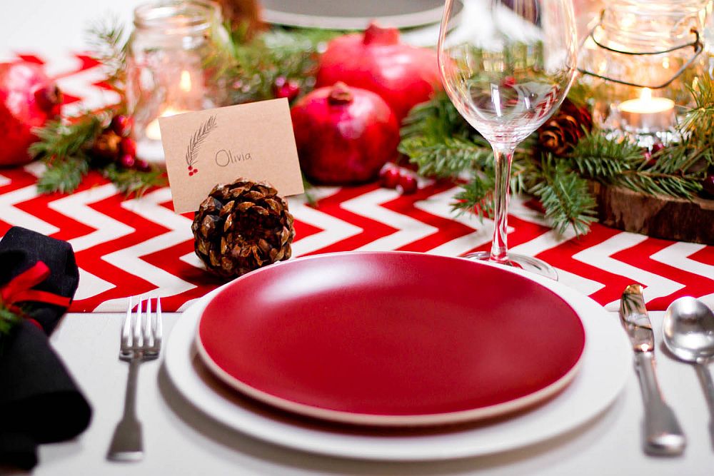 Use red and white table runner and tableware to add festive appeal to the modern dining room