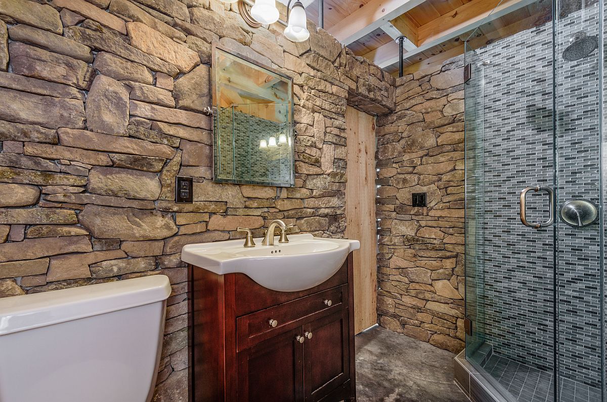 Using stone in the rustic bathroom to accentuate its look