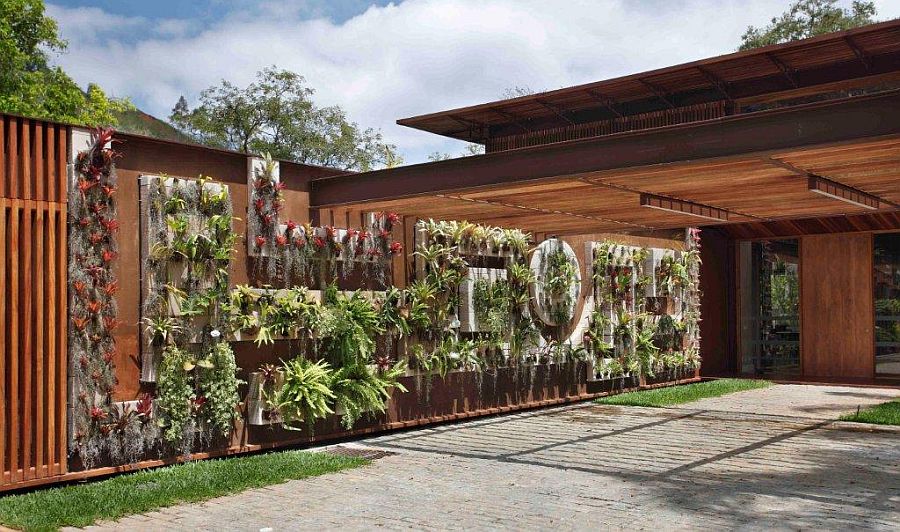 Vertical garden and floweing plants bring an additional layer of greenery to the entrance