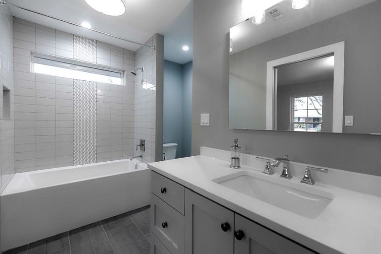 Small Gray Bathroom With White Vanity