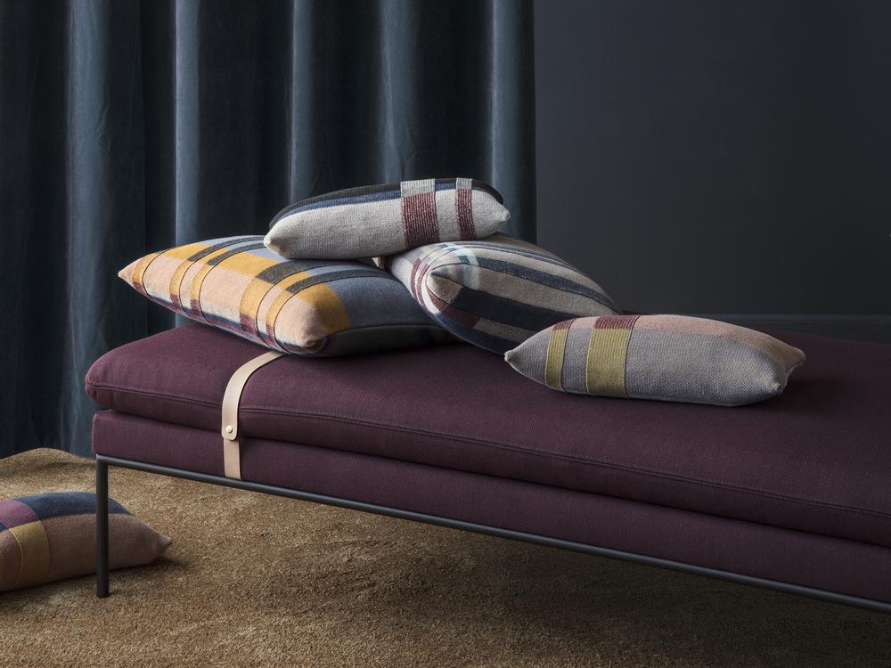 Wine-colored fabric on a Scandinavian daybed