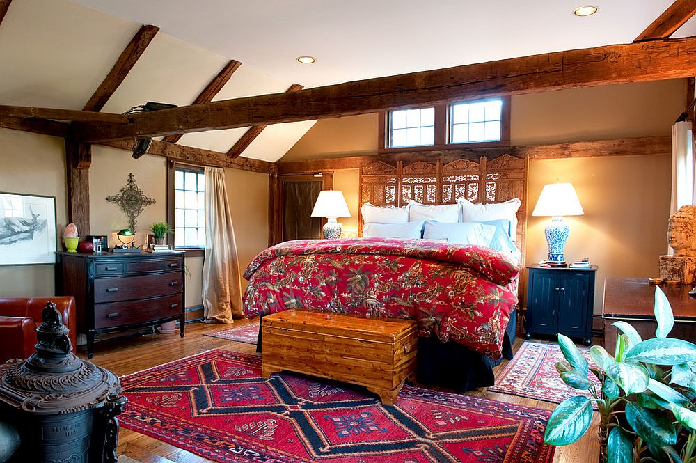 Wooden-ceiling-beams-play-a-big-role-in-the-overall-design-of-this-cozy-farmhouse-style-bedroom