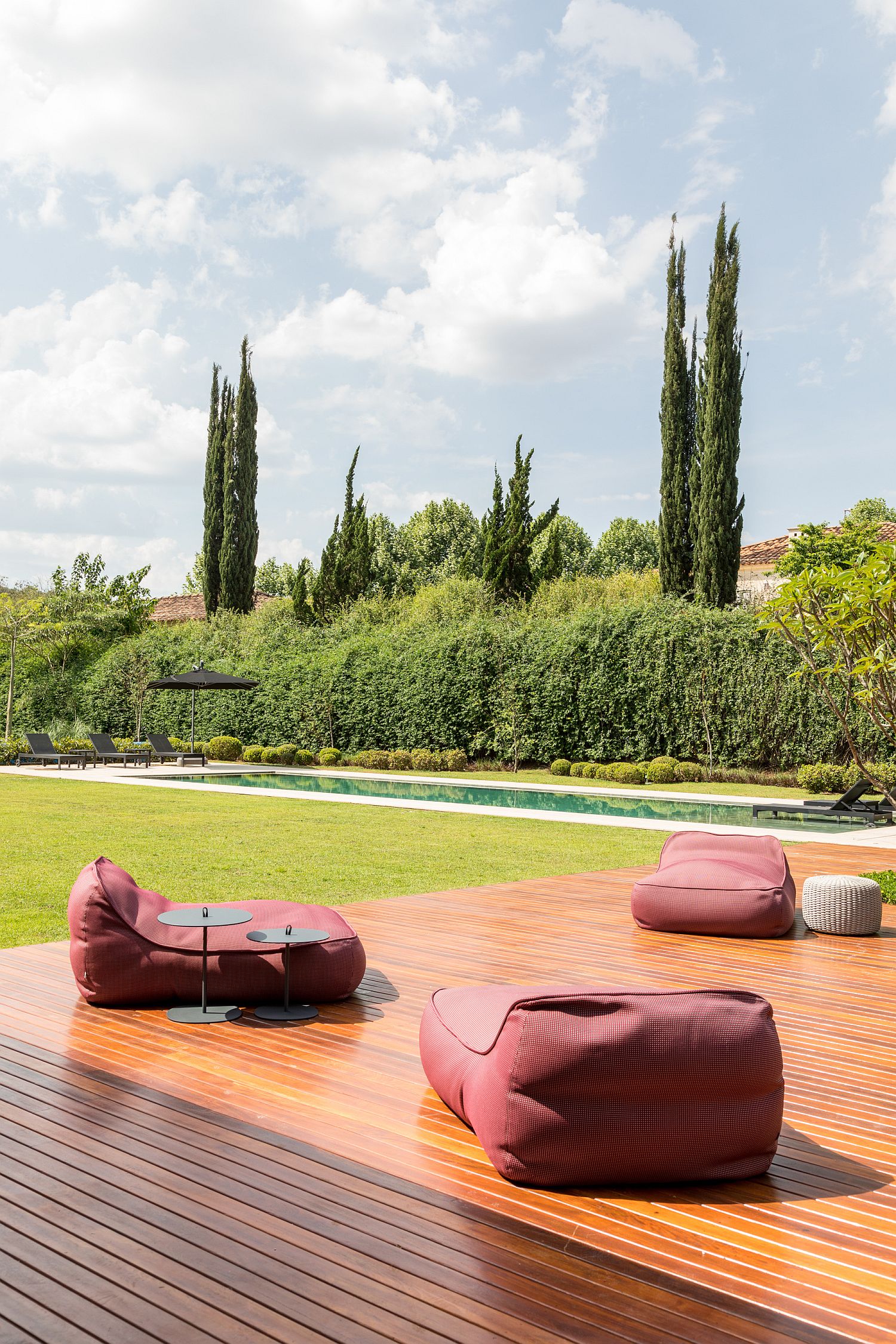 Wooden deck next to the pool for the modern Brazilian