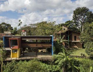 Wood and Concrete Pavilion Extends Modern Brazilian Home into Greenery