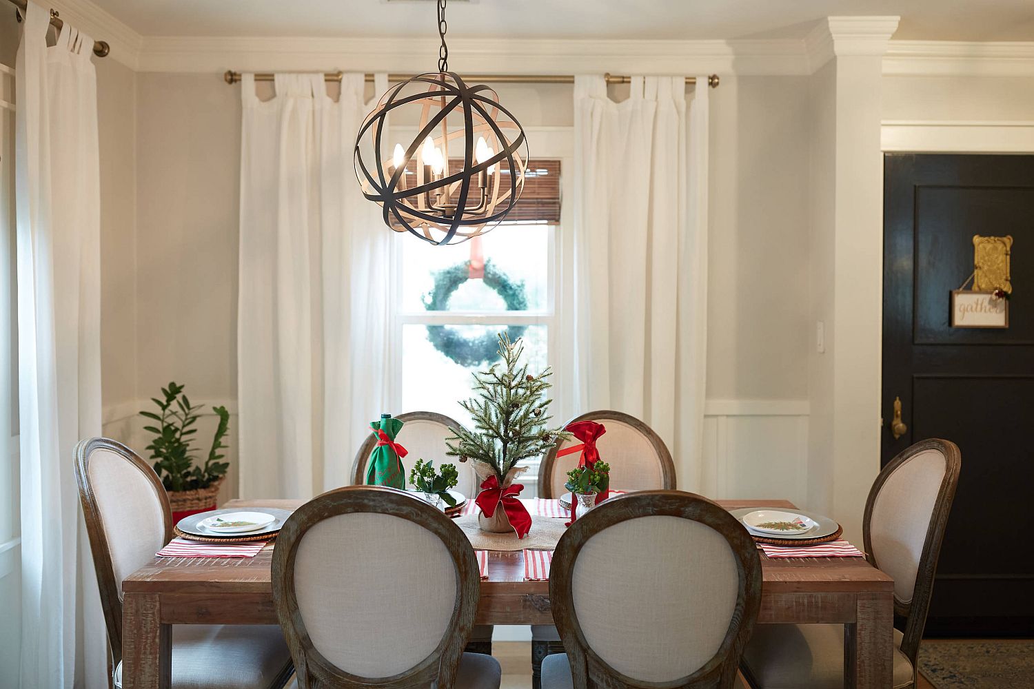 Wreath outside the window and dining table decorations bring Holiday cheer to this dining room in San Francisco