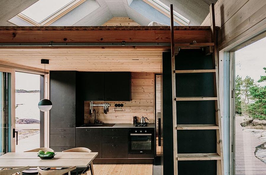 dashing black shelves with modern ergonomics create efficient kitchen inside the cabin