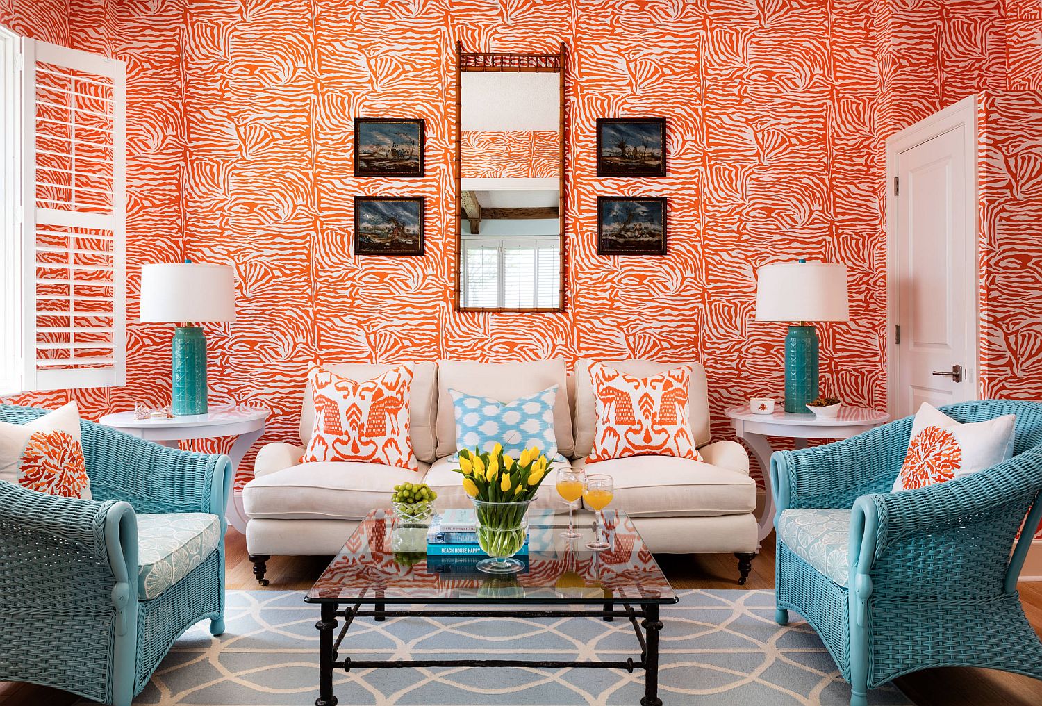 Awesome use of orange in the modest tropical living room