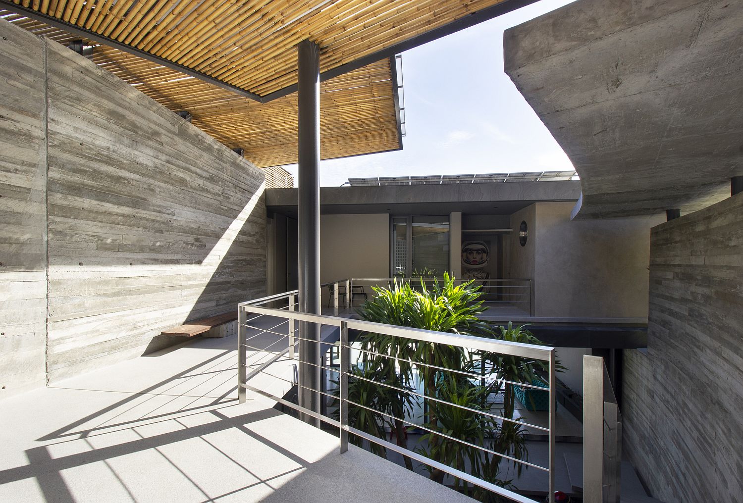 Bamboo screens and blinds protect the courtyard of the house
