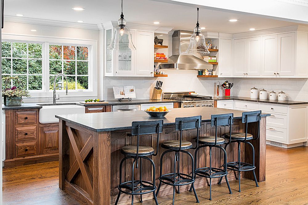 Bar stools and woodsy island bring rustic touches to the spacious farmhouse kitchen