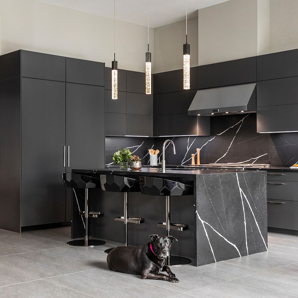 Black cabinets and stone kitchen island gives the contemporary kitchen a polished look