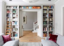 Bookshelf-that-wraps-itself-around-the-doorway-helps-create-a-lovely-wall-of-books-in-the-living-room-with-ample-natural-light-217x155