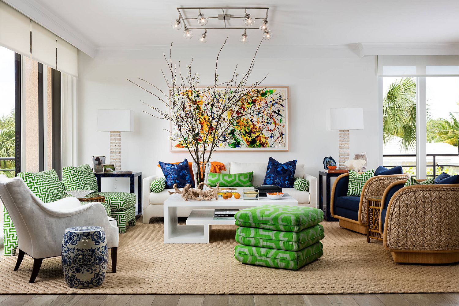 Bright pops of blue and green enliven this tropical style living room in white