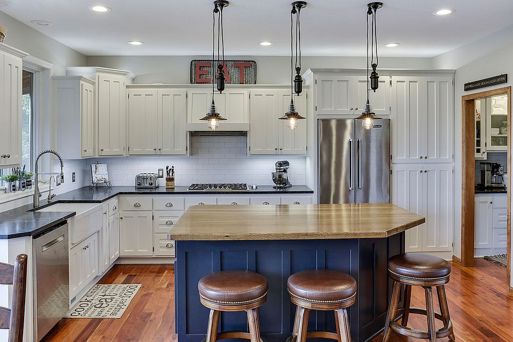 Cabinets draped in white enamel coupled with bright blue island in the kitchen