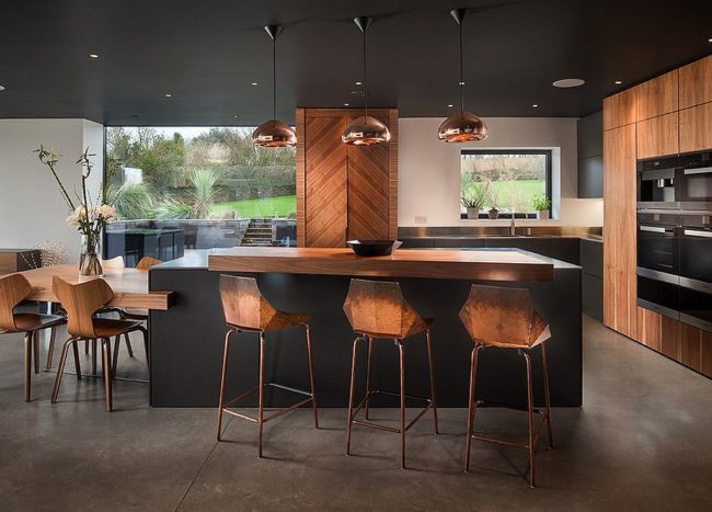 Chic Contemporary Bar Stools Along With Sparkling Copper Pendant Lights And Black And Wood Kitchen Surfaces 650x467 
