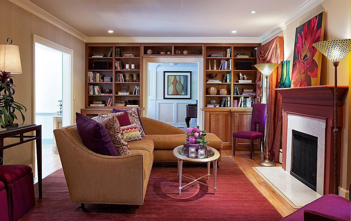 Colorful eclectic living room of New York home with shelves wrapped around the doorway