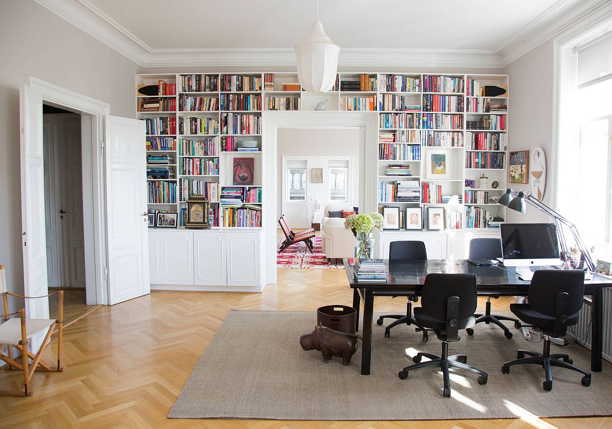 Combining-the-open-white-shelves-with-closed-cabinets-around-the-doorway-in-the-home-office