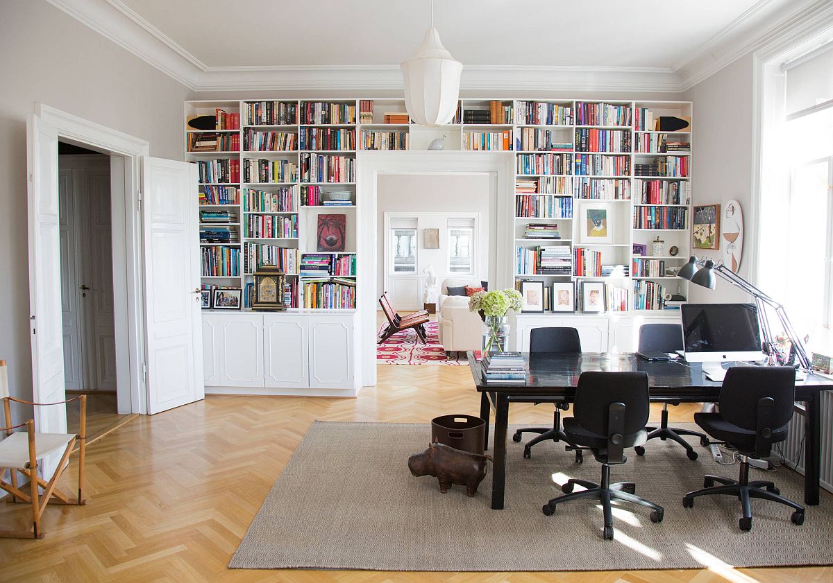 Combining the open white shelves with closed cabinets around the doorway in the home office