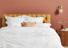 Comfy-bedroom-featuring-earthy-pink-walls-and-a-mustard-bed-217x155