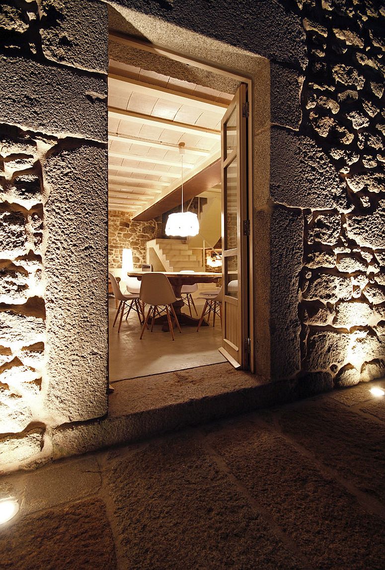 Cozy lighting and reclaimed stone walls create fabulous Spanish house with modren-rustic charm