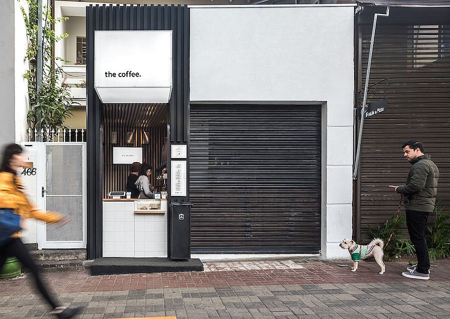 Dark exterior of the Coffee Shop matches with those of the shops next to it