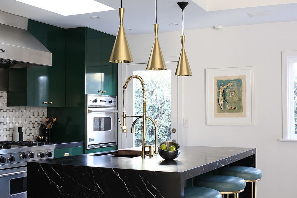 Dark green cabinets coupled with black kitchen island and dazzling copper pendant lights