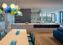 Dining-area-with-ample-natural-lighting-aling-with-colorful-pendant-lights-217x155