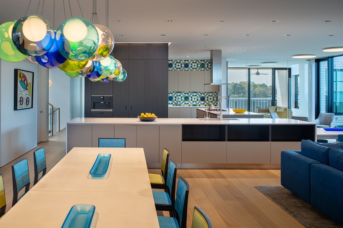 Dining-area-with-ample-natural-lighting-aling-with-colorful-pendant-lights