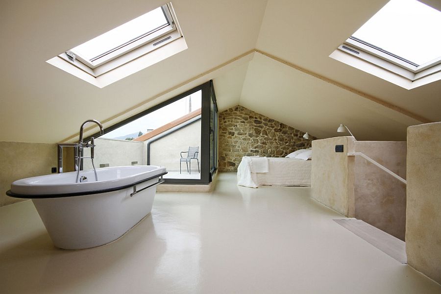 Exquisite upper level bedroom of the revamped Spanish House in stone with ample natural light