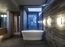 Freestanding-bathtub-in-white-for-the-concrete-contemporary-bathroom-217x155