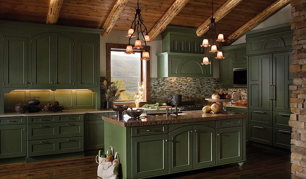 Gallery kitchen of mountain retreat with dark green cabinets, woodsy ceiling and stone surfaces all around