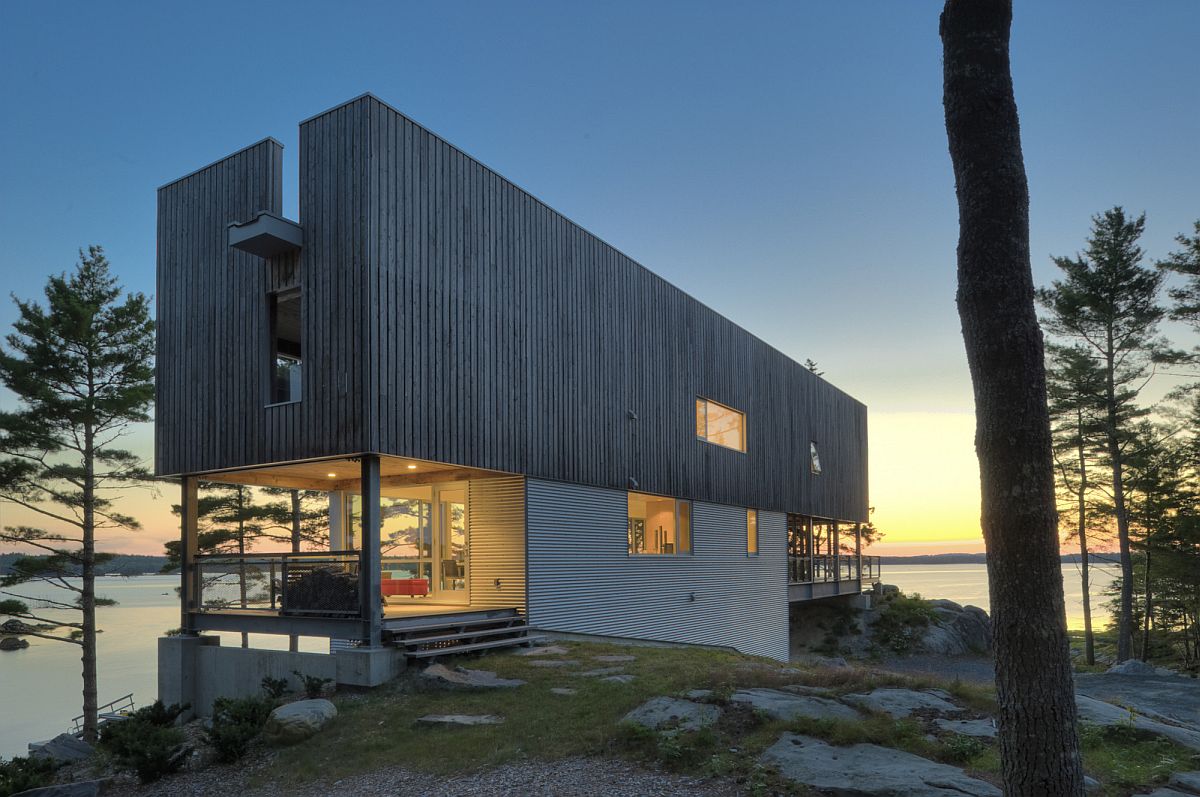 Gorgeous coantemporary home sits on two bedrock outcrops next to the sea