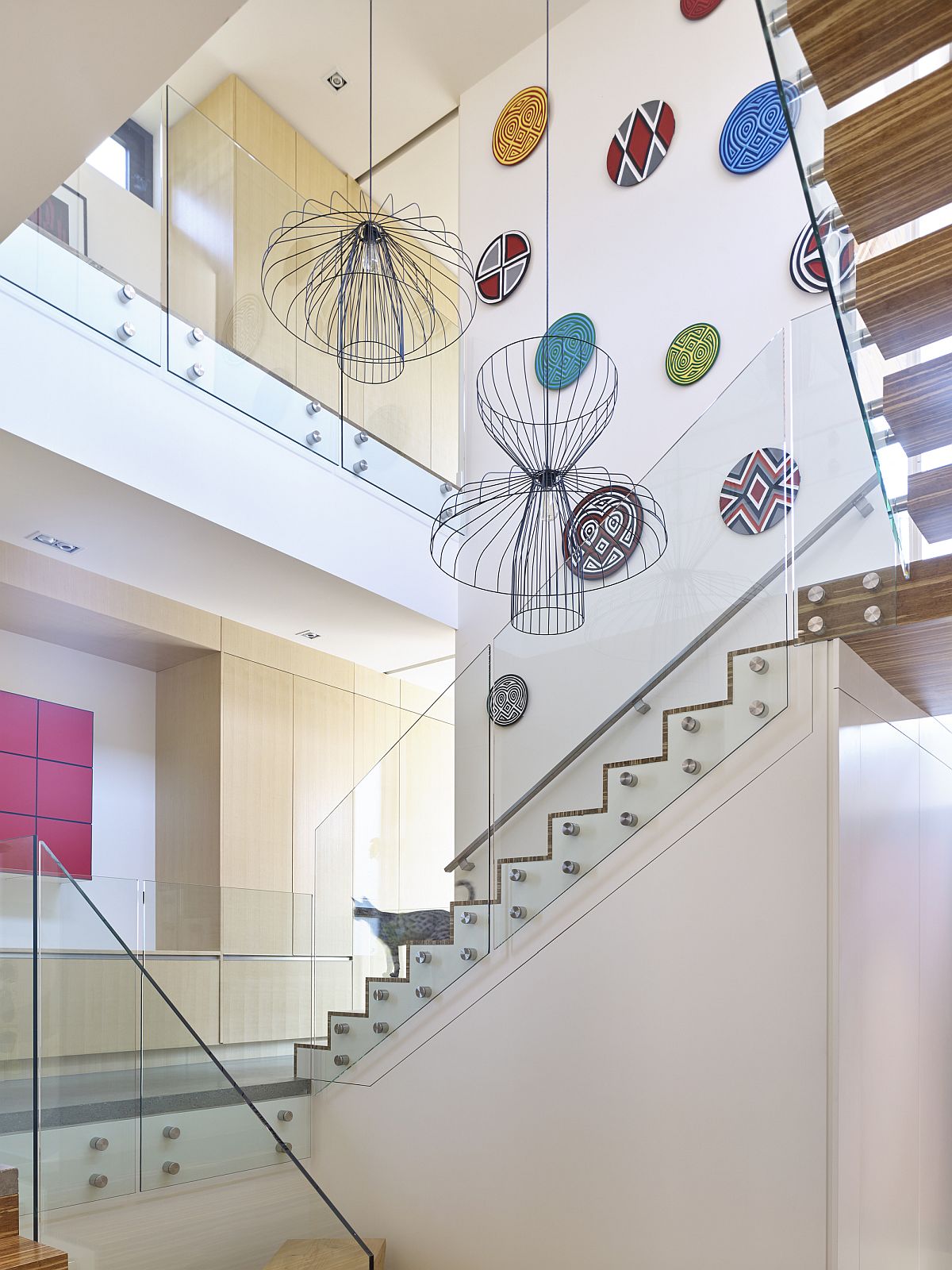 Light-well and staircase of the conemporary Canadian home wih a splash of color