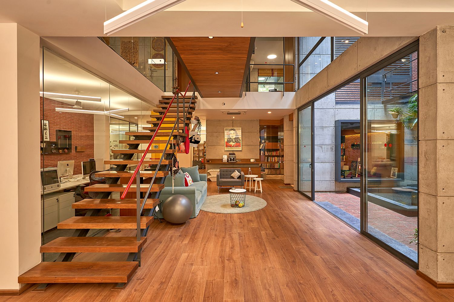 Look at the kitchen, library and other social zones inside the Lopez Design Office