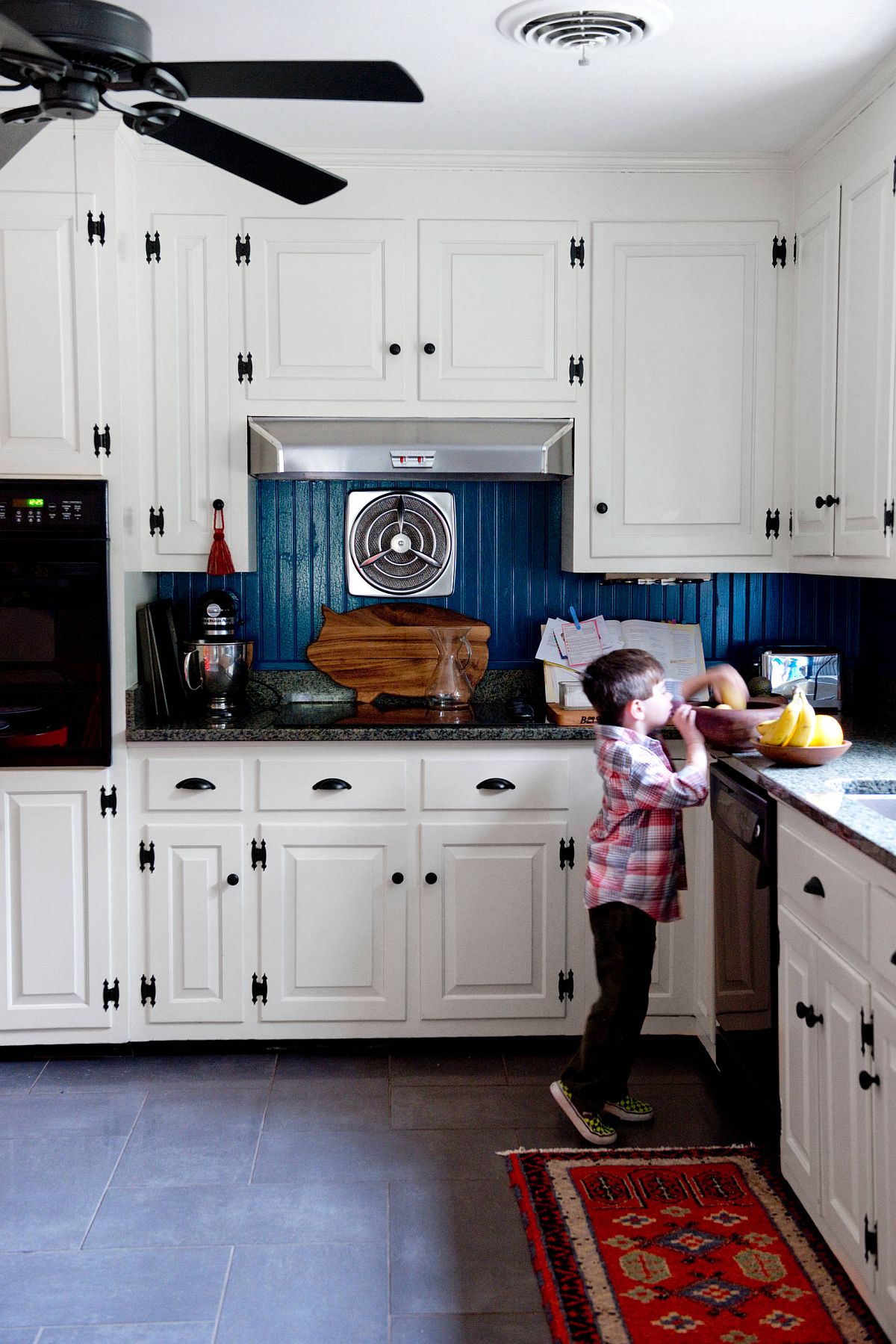 Modern eclectic kitchen in white with beautiful blue backsplash