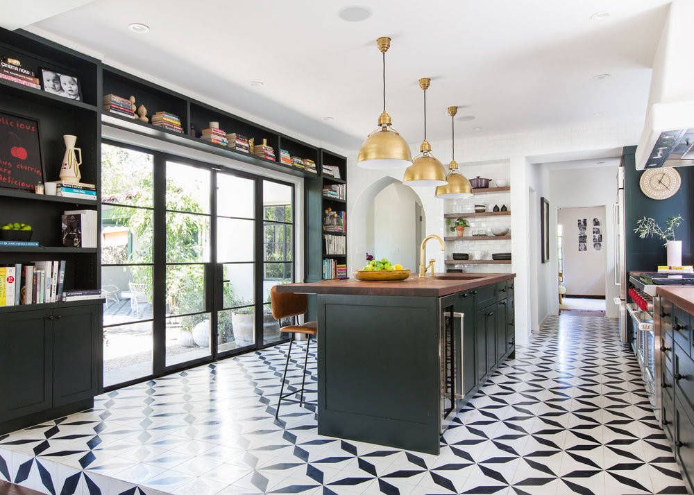 Modern-industrial-style-kitchen-with-large-glass-doors-and-bookshelves-in-black-around-it