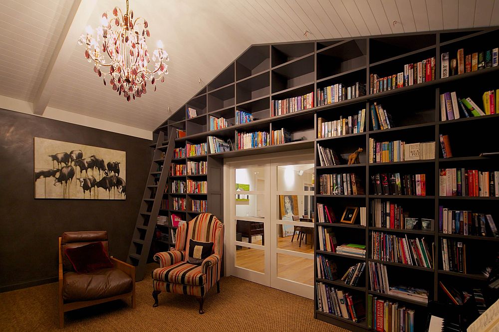 Modern living room with vaulted ceiling and bookshelves in black