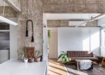 Natural-light-illuminates-the-rugged-concrete-living-space-of-the-apartment-217x155