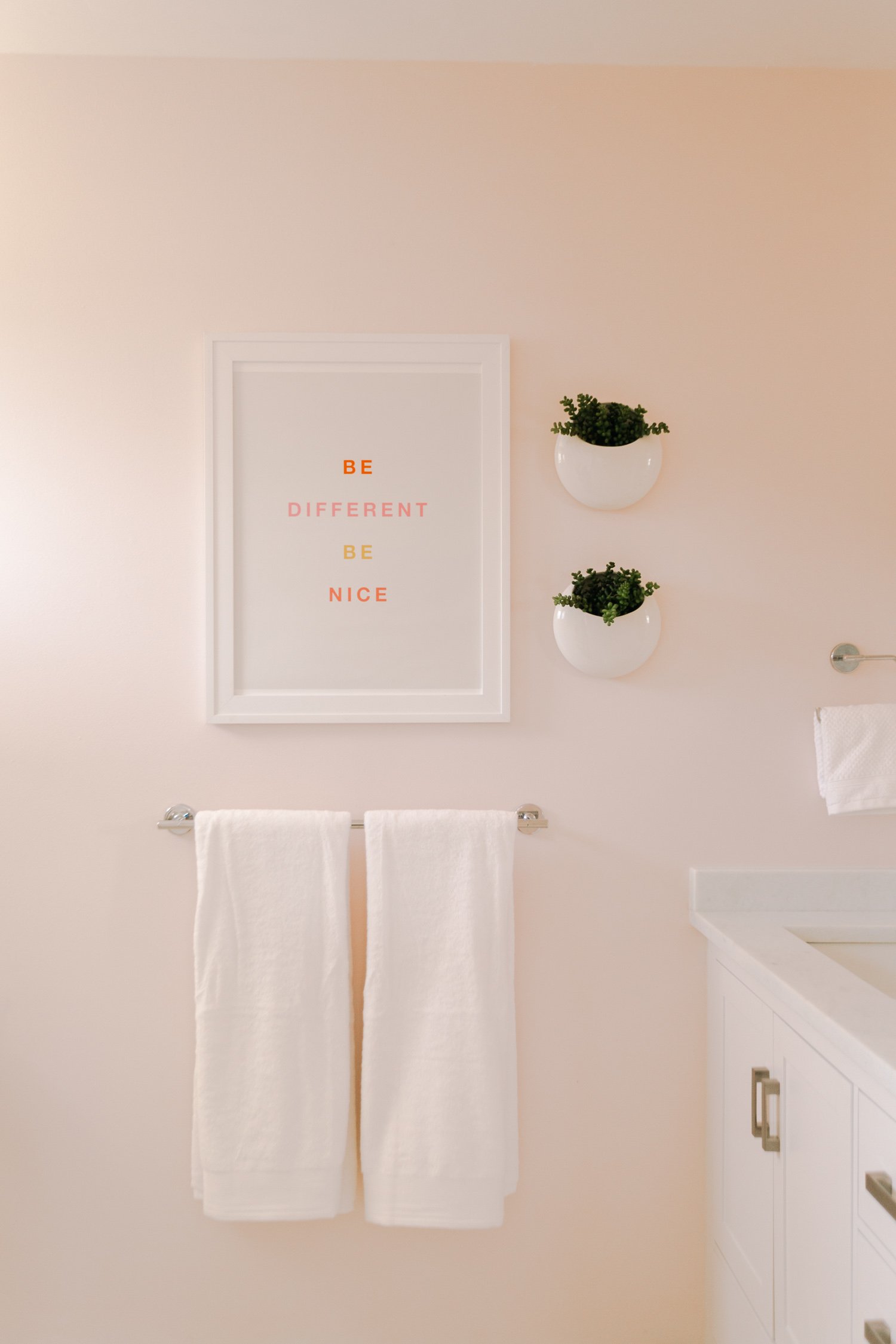 Quotable artwork featured in a bathroom makeover at A Beautiful Mess