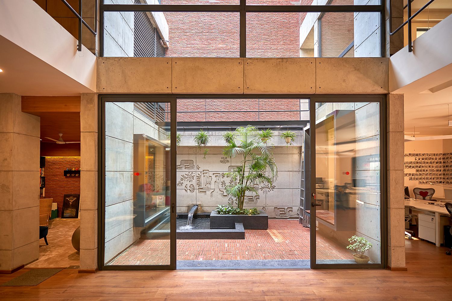 Sliding glass doors connect the interior with the beautiful modern courtyard