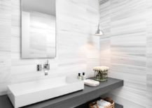 Slim-stone-vanities-in-gray-are-perfect-for-this-contemporary-bathroom-217x155