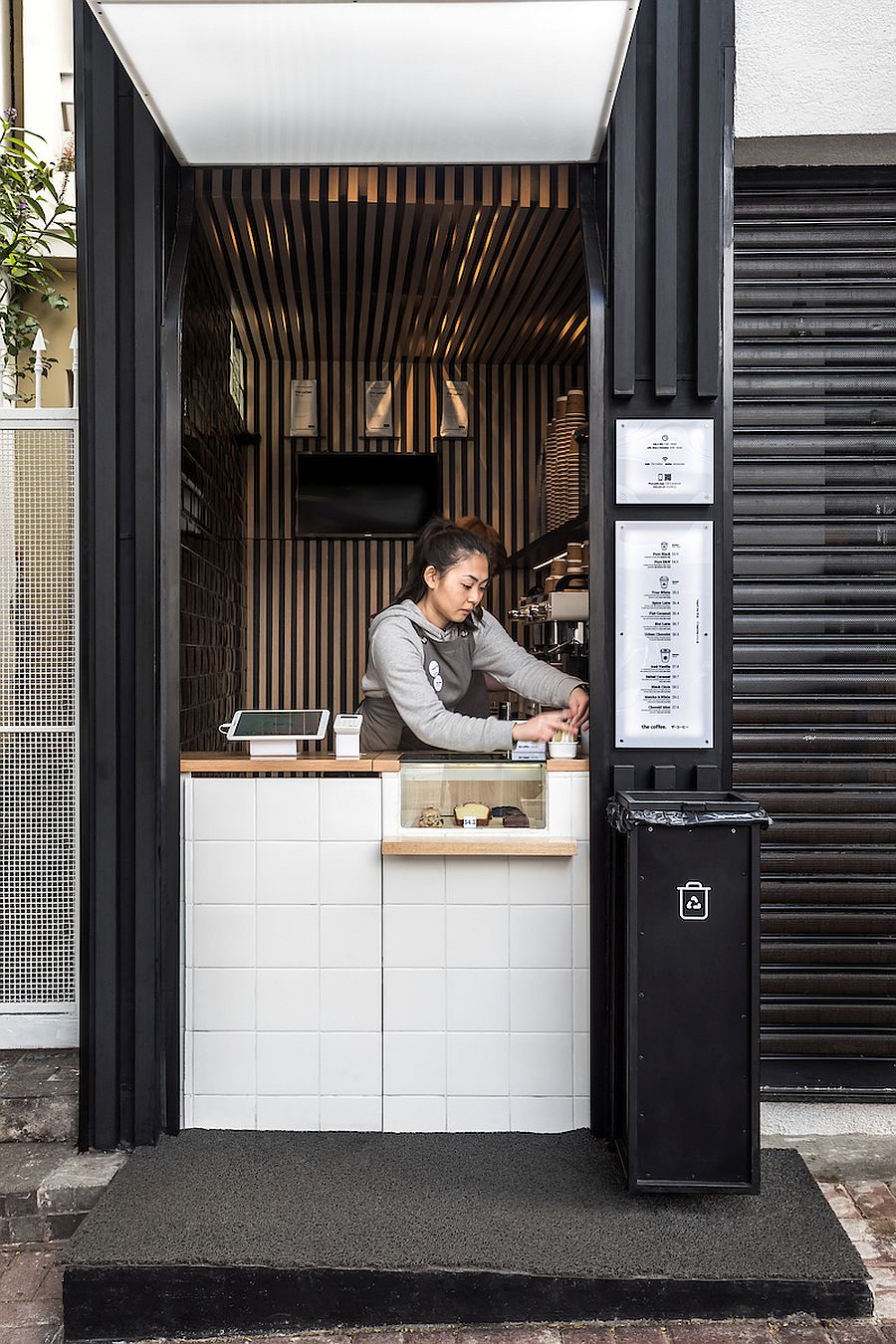 Small cube design of the coffee shop gives it space-savyy appeal