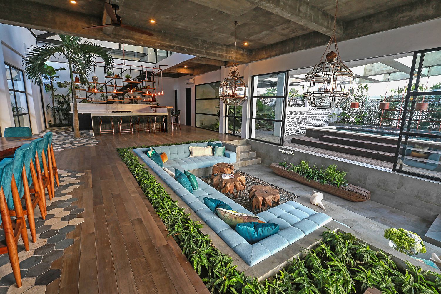 Sunken living room for the spacious living area draped in concrete