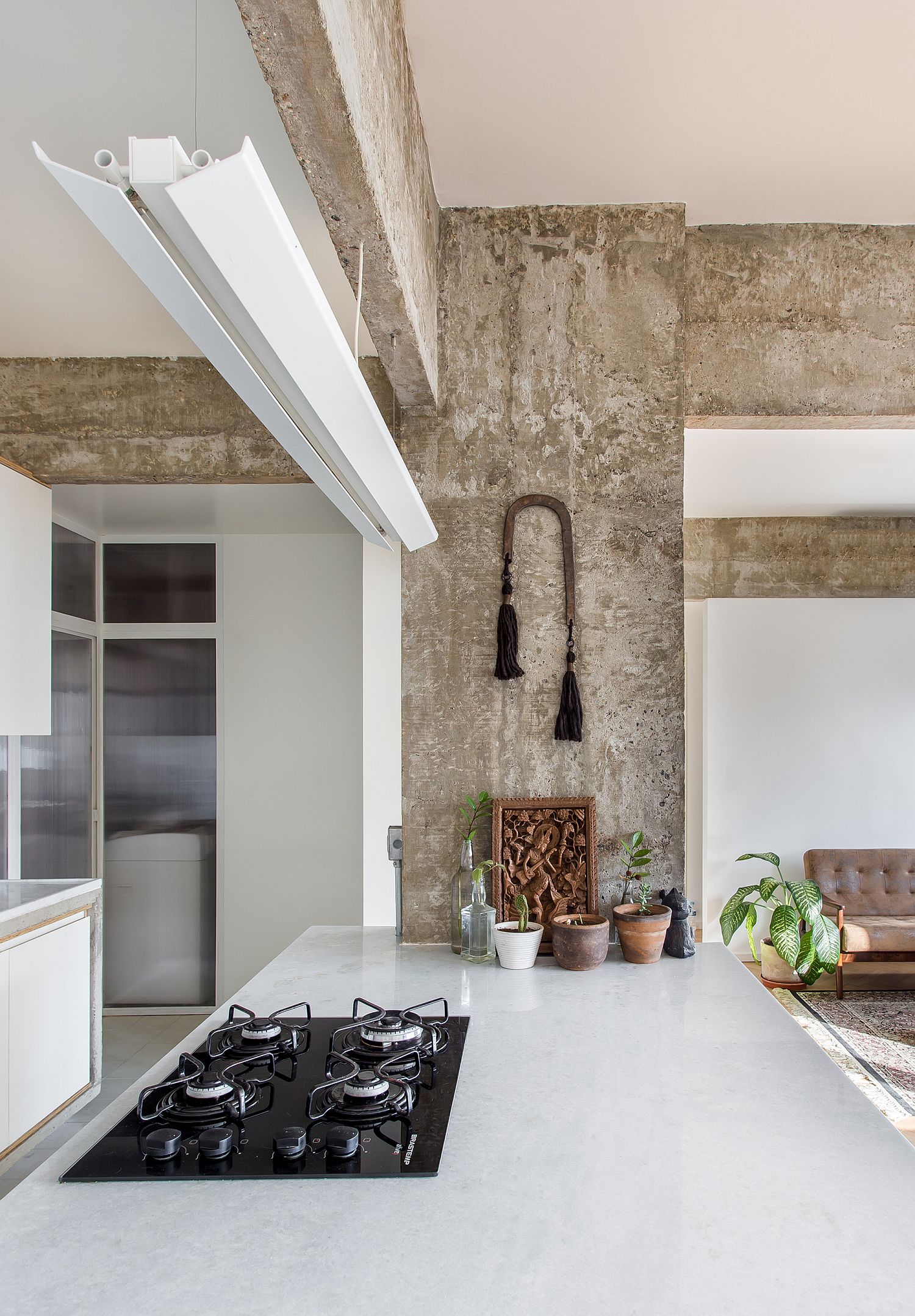 White finishes in the kitchen along with countertops that match it beautifully