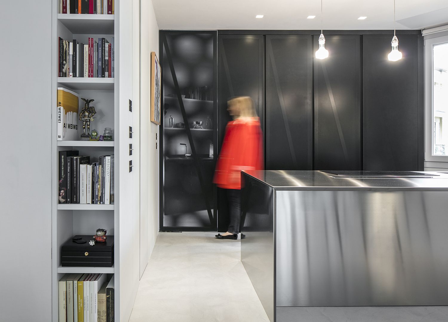 Wonderful use of black shapes the kitchen cabinets