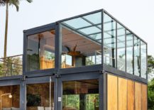 Wood-and-glass-soften-the-visual-impact-of-the-steel-frame-brought-in-by-the-shipping-container-units-217x155