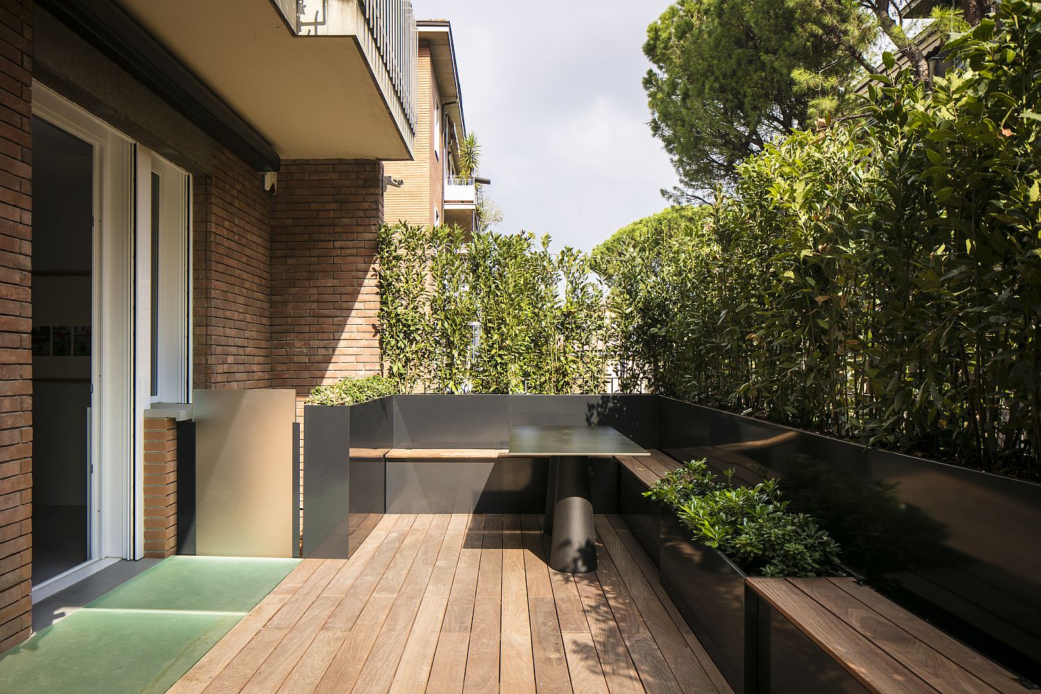 Wooden deck outside the kitchen and the livig area of the Italian apartment
