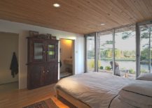 Woodsy-ceiling-and-floor-of-the-bedroom-with-view-of-the-sea-from-he-window-217x155