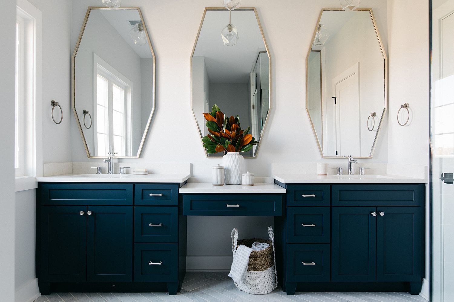 A tinge of green coupled with blue for the expansive bathroom vanity in the modern farmhouse setting