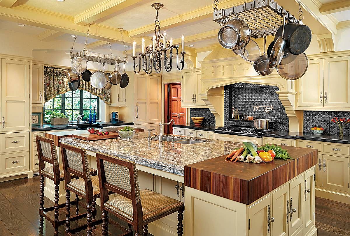 Add the butcher block to the large kitchen island with stone countertop and ample shelf space